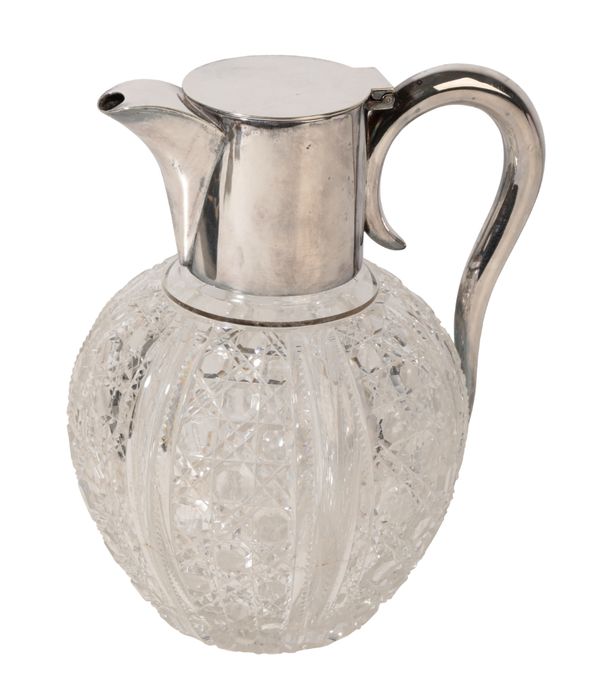 A SILVER-PLATED AND CUT-GLASS CLARET JUG