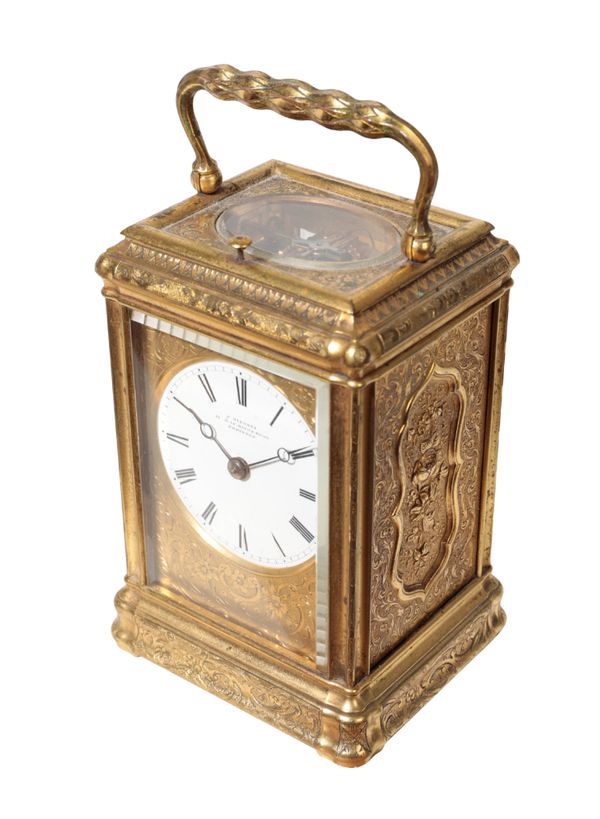 A VICTORIAN GILT BRASS REPEATING CARRIAGE CLOCK