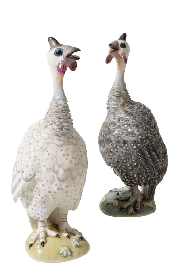 A PAIR OF LATE CONTINENTAL PORCELAIN FIGURES OF TURKEYS