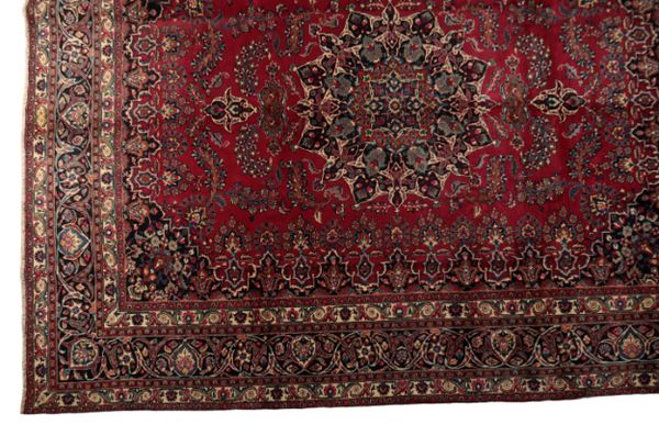 A NORTH EAST PERSIAN SIGNED CARPET