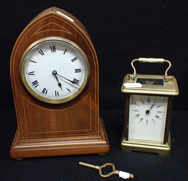 AN EDWARDIAN MAHOGANY CASED MANTEL CLOCK