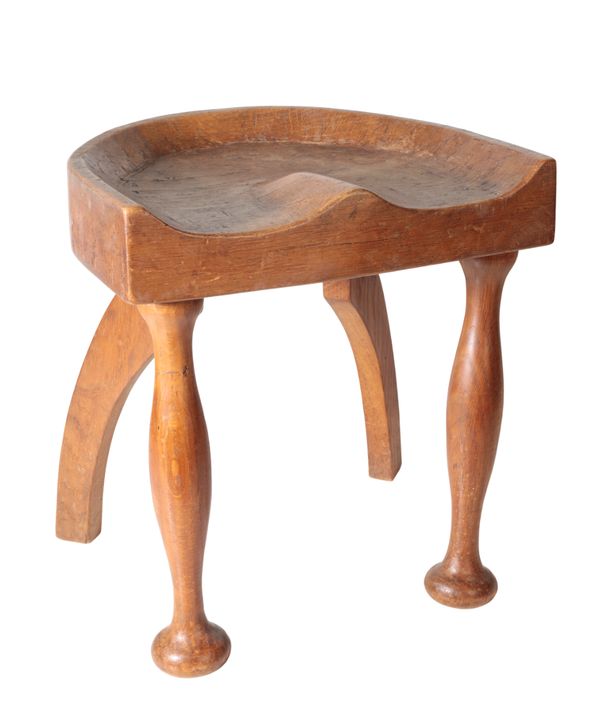 AN OAK MILKING STOOL