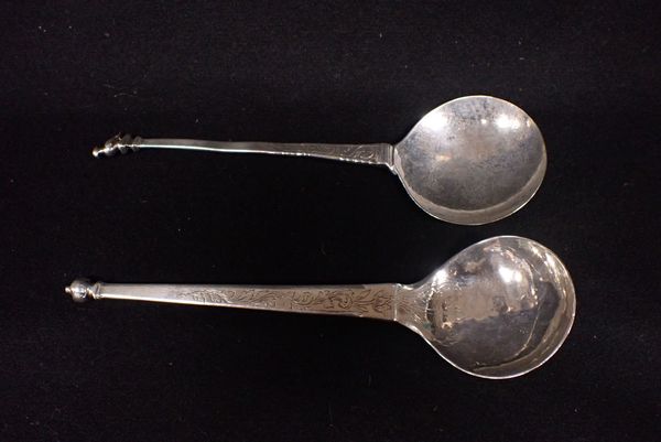 TWO WHITE METAL SPOONS OF ARCHAIC FORM