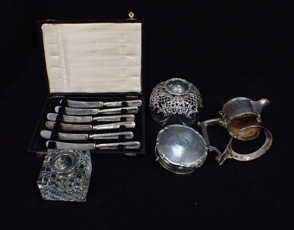 AN INKWELL WITH SILVER MOUNT AND A SILVER CLARET JUG MOUNT