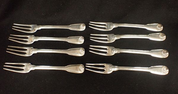 EIGHT WHITE METAL THREE-PRONGED FORKS