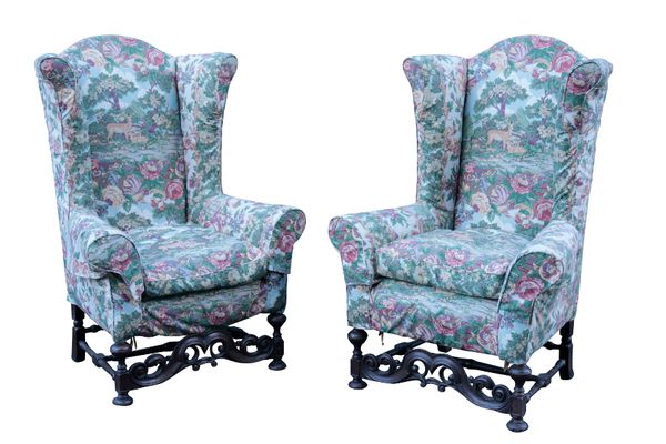 A PAIR OF WILLIAM AND MARY STYLE WALNUT WING ARMCHAIRS