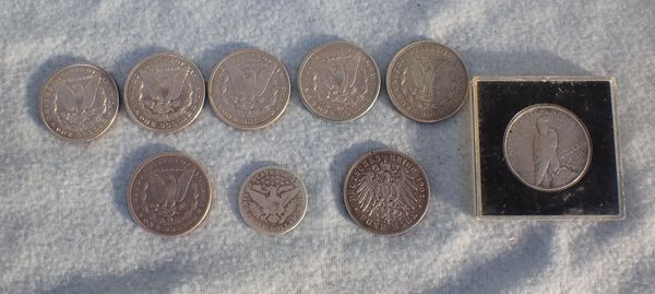 A COLLECTION OF SILVER DOLLAR COINS