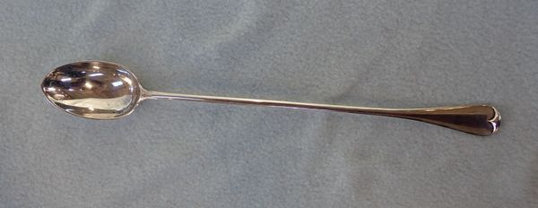 A LONG HANDLED SILVER SPOON