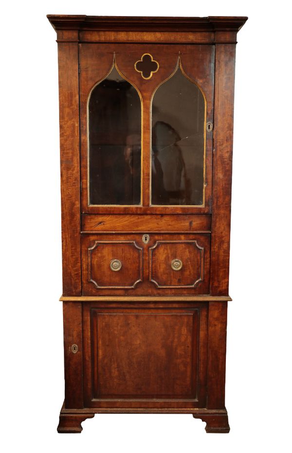 A REGENCY STYLE MAHOGANY AND PARCEL-GILT GOTHIC CABINET