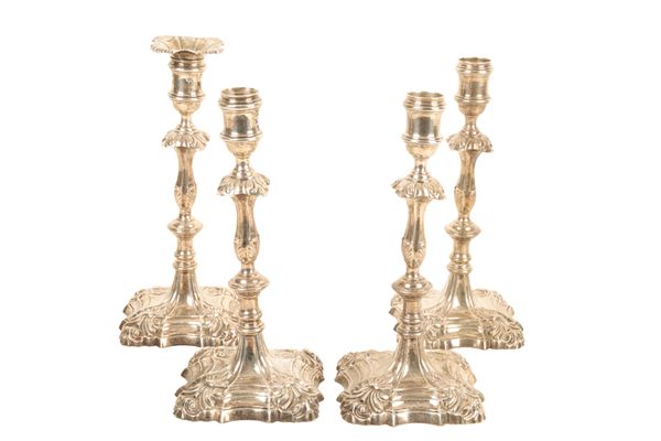 A SET OF FOUR GEORGE II SILVER CANDLESTICKS