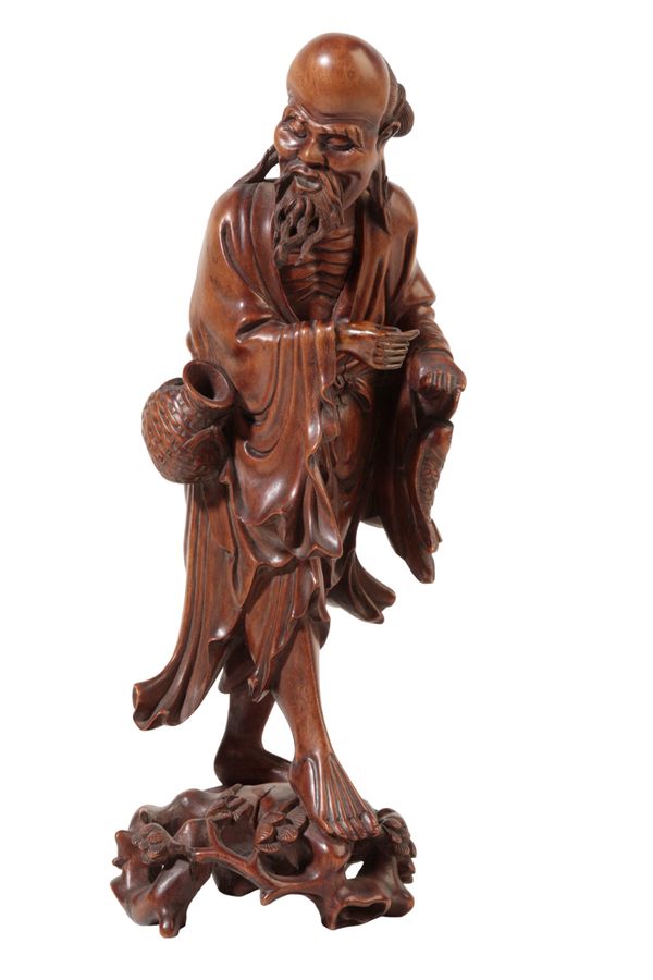 A CHINESE BOXWOOD FIGURE OF AN IMMORTAL, QING,