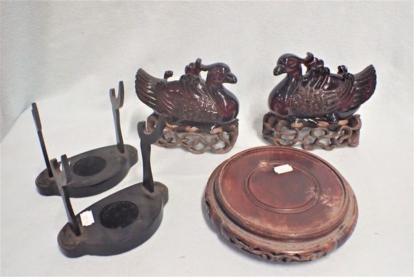 A PAIR OF CHINESE DUCKS ON CARVED STANDS