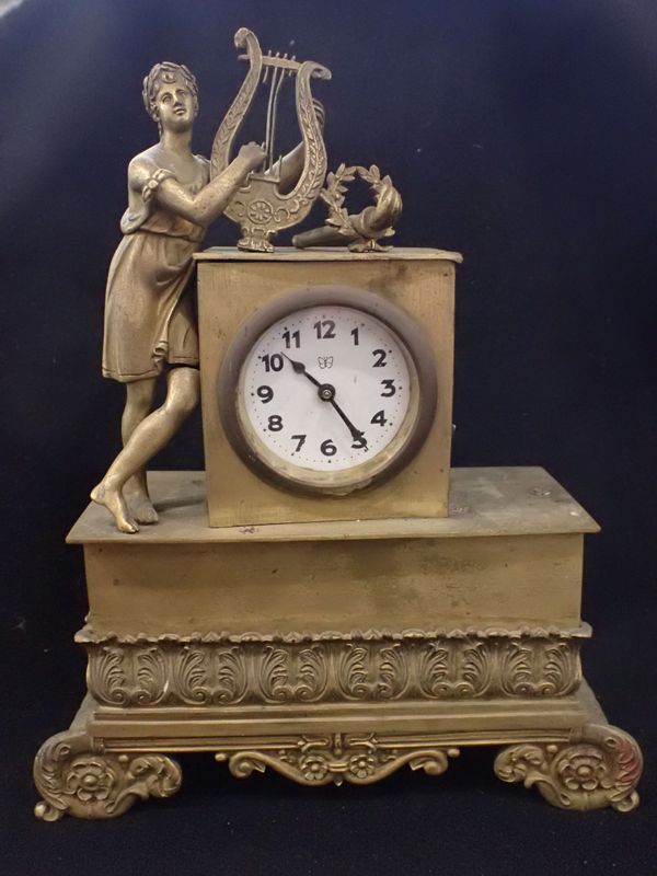 A 19TH CENTURY EMPIRE STYLE BRASS CLOCK CASE