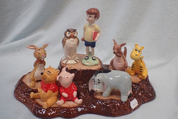 A SET OF EIGHT BESWICK WALT DISNEY WINNIE THE POOH FIGURES