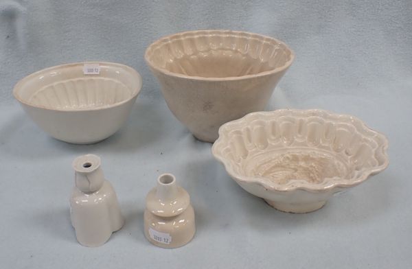 THREE VICTORIAN POTTERY FOOD MOULDS AND TWO PIE FUNNELS