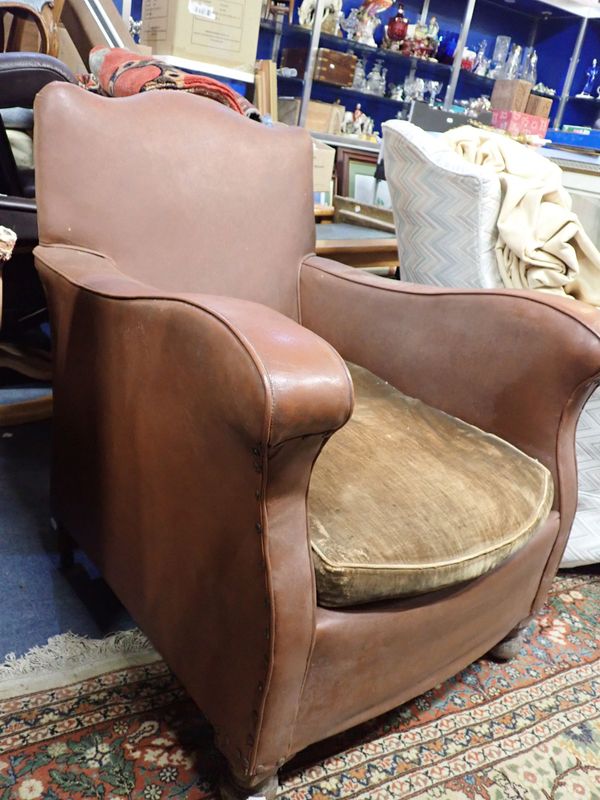 A 1920S UPHOLSTERED ARMCHAIR