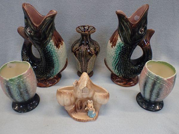 A PAIR OF MAJOLICA TYPE POTTERY GURGLE JUGS