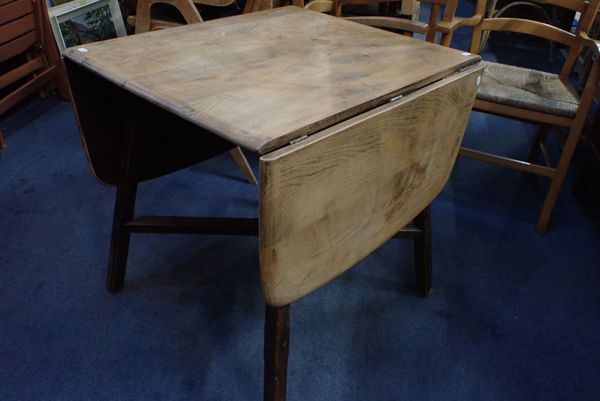 AN ERCOL DROP-FLAP DINING TABLE