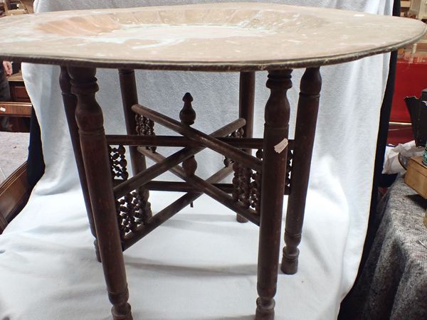 A PERSIAN TURNED FOLDING TABLE