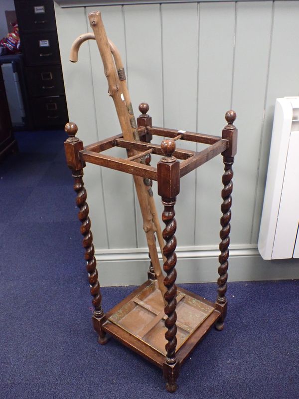 A 1920S OAK BARLEY-TWIST STICK STAND