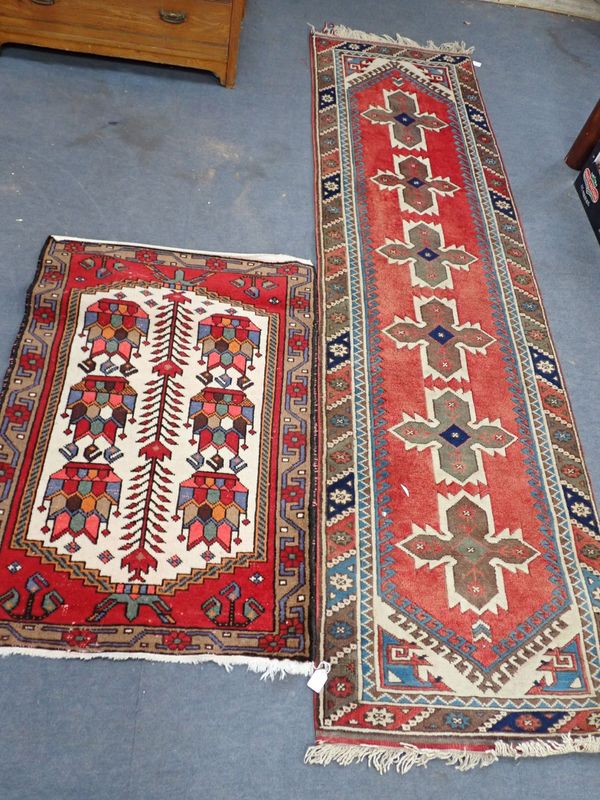 A RED GROUND AFGHAN TYPE RUNNER