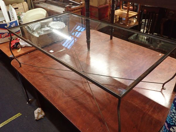 A METAL FRAMED COFFEE TABLE WITH GLASS TOP