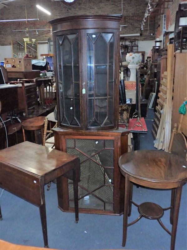 A BOW FRONTED CORNER DISPLAY CABINET