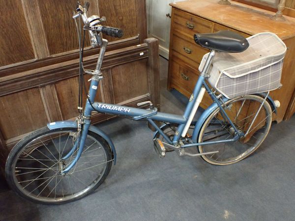 A  VINTAGE RALEIGH TRIUMPH FOLDING BICYCLE
