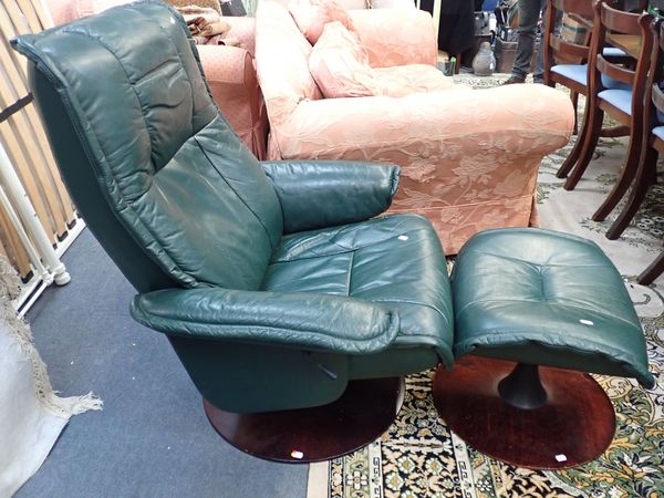 ANDERSSONS OF SWEDEN: A RECLINING SWIVEL CHAIR AND FOOTSTOOL