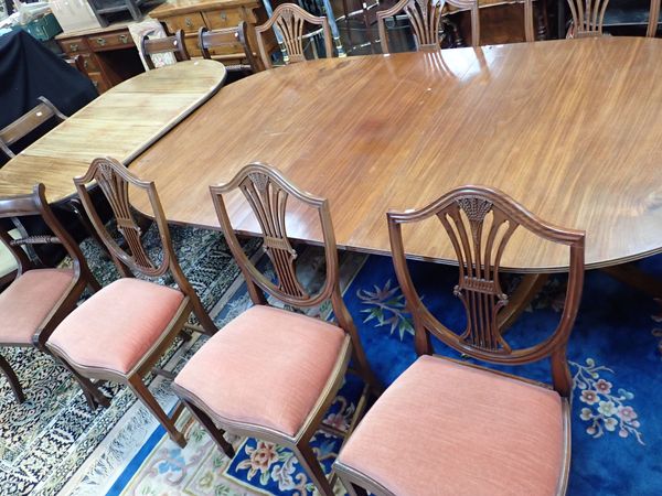 A REGENCY STYLE MAHOGANY TWIN PEDESTAL DINING TABLE