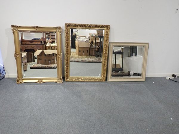 A MODERN GILTWOOD AND COMPOSITION FRAMED MIRROR