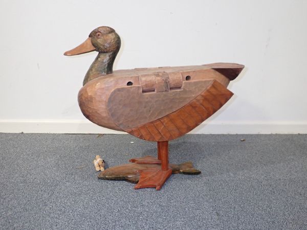 A LARGE CARVED WOODEN DUCK