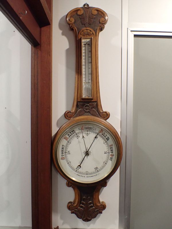 A VICTORIAN GOLDEN OAK-CASED ANEROID BAROMETER