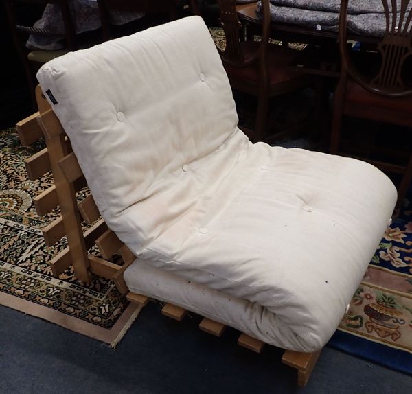 A SINGLE FUTON, WITH HARDWOOD  CONVERTIBLE BASE