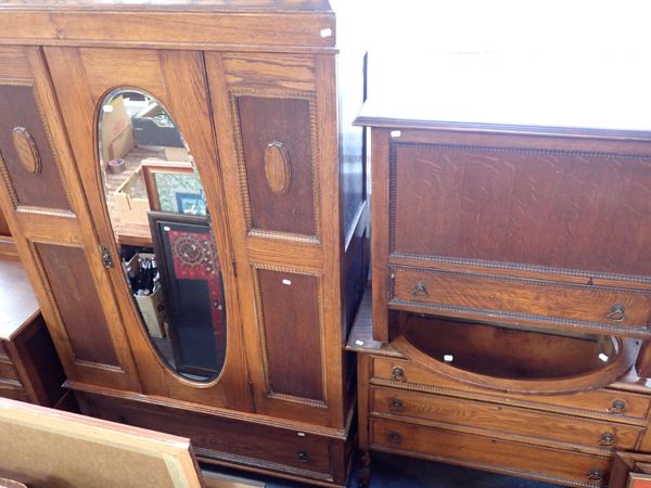 A 1920S OAK 'JACOBETHAN' BEDROOM SUITE