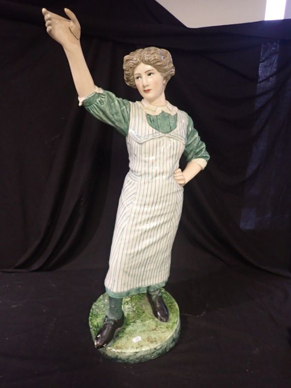 A EARLY 20TH CENTURY POTTERY SHOP DISPLAY FIGURE