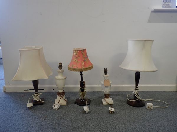 A GROUP OF THREE TRUNED WOOD LAMP BASES