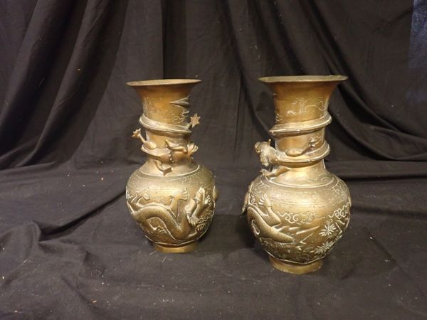 A PAIR OF ORIENTAL BRASS DRAGON VASES