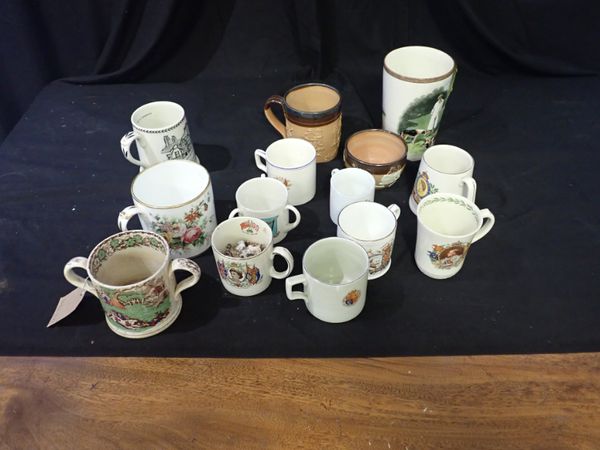 A COLLECTION OF CERAMIC CUPS AND MUGS