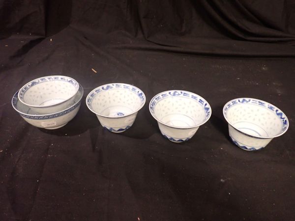 A SET OF FOUR BLUE AND WHITE CHINESE TEA BOWLS