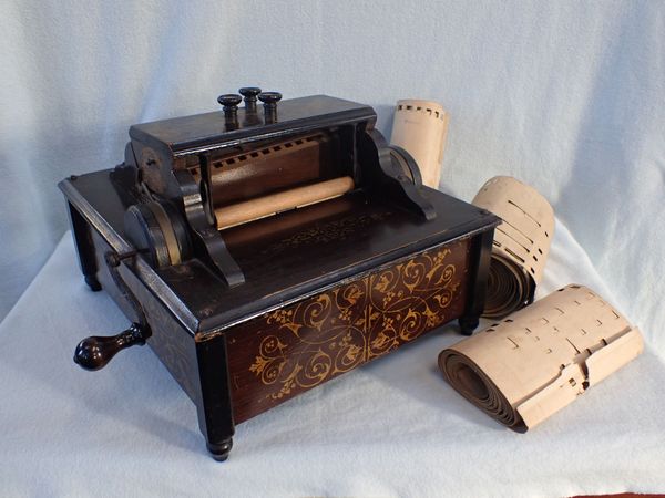 A LATE 19TH CENTURY  'ORCHESTRAL ORGANETTE' ROLLER ORGAN