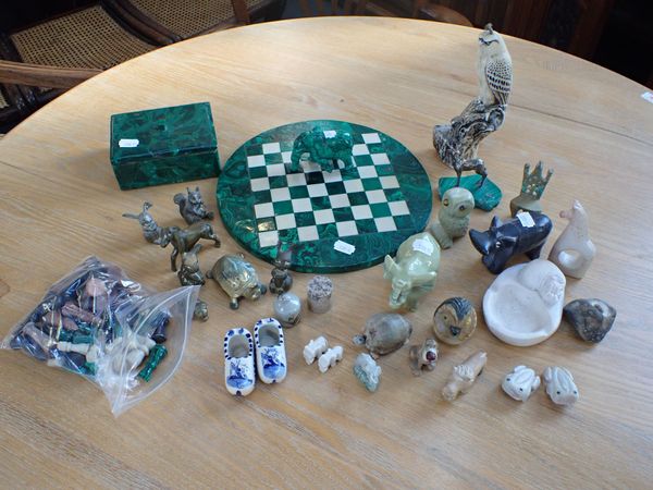 a MALACHITE CHESS SET, AN ELEPHANT