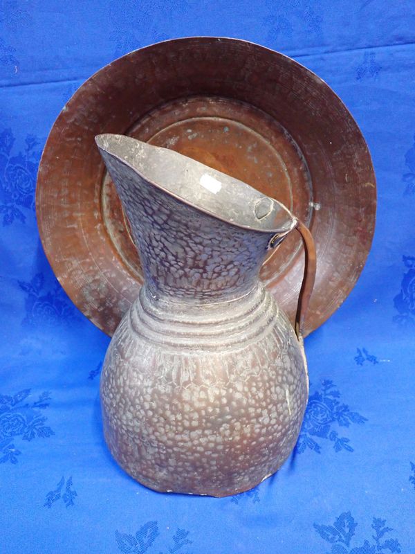 A PERSIAN COPPER EWER AND BASIN