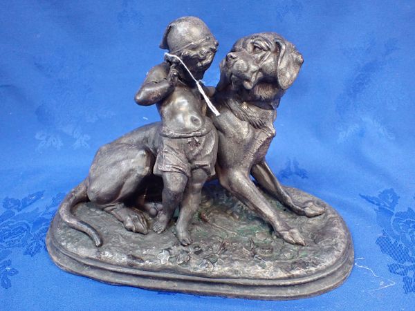 A VICTORIAN SPELTER GROUP OF A CHILD WITH DOG