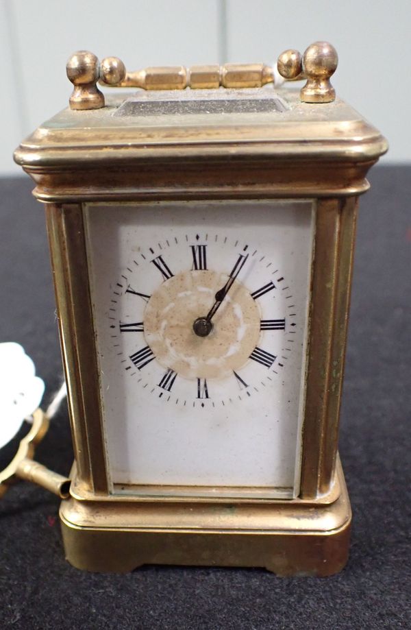 A MINIATURE  BRASS-CASED CARRIAGE CLOCK