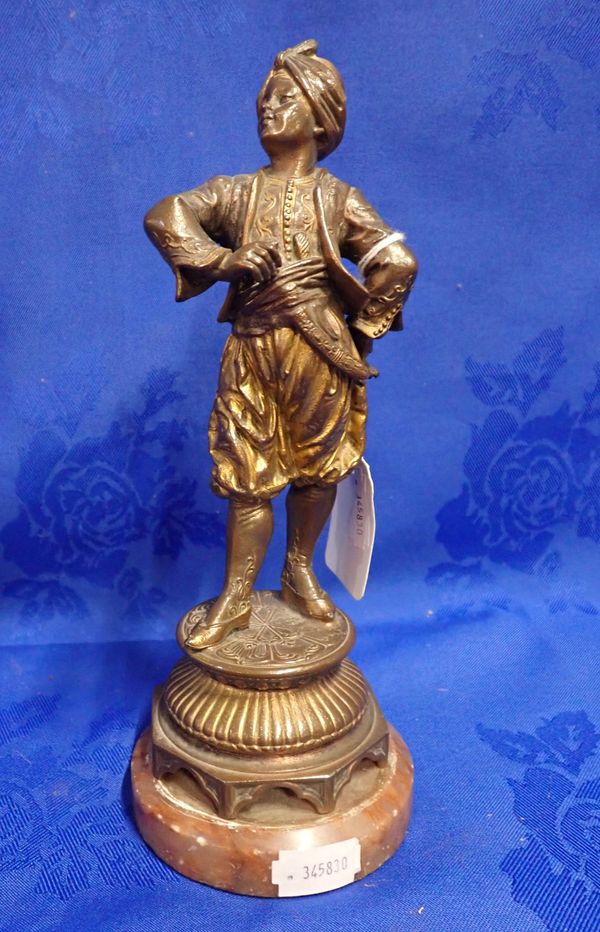 GILDED BRONZE FIGURE OF A YOUNG MAN IN MIDDLE EASTERN DRESS