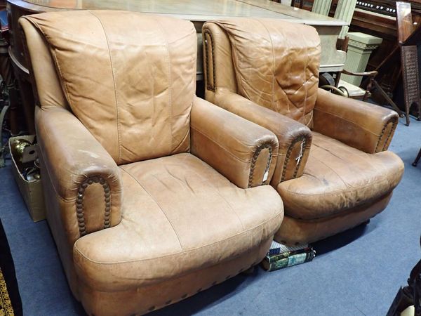 A PAIR OF LEATHER UPHOLSTERED ARMCHAIRS