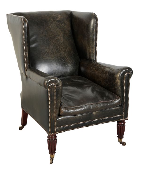 A REGENCY MAHOGANY LIBRARY WING ARMCHAIR