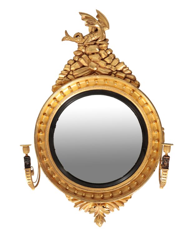 A REGENCY STYLE CARVED GILTWOOD CONVEX MIRROR