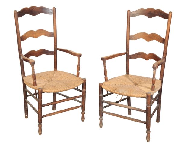 A PAIR OF FRENCH PROVINCIAL OAK RUSH SEAT ARMCHAIRS